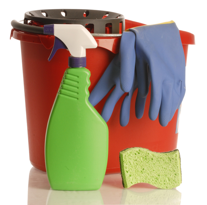 household cleaner with rubber gloves bucket and sponge